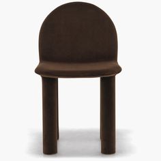 a brown chair sitting on top of a white floor