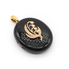 A Victorian yellow gold, black paste, and seed pearl locket, comprising two oval cabochons of black paste, twenty-two seed pearls, set in 9 karat yellow gold, with an 18 karat yellow gold bale.    My favourite thing about this Victorian Yellow Gold Pearl and Black Paste Mourning Locket is the smooth black stones. What's yours? Perhaps the shimmering pearls? Or the meaningful design?  This symbolic Victorian mourning locket is comprised with two oval cabochons of black paste (glass), which have been highly polished to give the most tactile, pebble-like look and feel. The front of the locket is adorned with seed-pearl set lily of the valley motif. Lily of the valley is a flower rife with symbolism, and is a symbol of pain, sadness, and purity, and is representation of the tears of the mother Pearl Locket, Meaningful Design, Unboxing Experience, Black Stones, Pearl Set, Seed Pearl, Pure Gold, Pearl Size, Black Stone