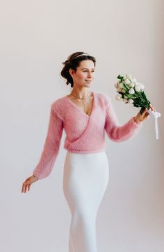 "Mohair Cardigan Bridal Sweater . Mohair jacket will allow you to keep warm in winter at a wedding and festive event, and at the same time look truly beautiful and luxurious. The cardigan has a semi - fitted silhouette , the length reaches the waist . As a fastener, the cardigan has two long ties that you can tie beautifully at the back. Cardigan made of blend mohair wool yarn. In the photo color - 32 - pink. Model height 175 cm / 68.90 \" and is wearing size M. The model in the photo has a bole Elegant Fall Wedding Cardigan, Elegant Pink V-neck Sweater, Elegant Fitted Cardigan For Weddings, Elegant Pink Winter Cardigan, Elegant Wedding Sweater For Winter, Elegant Winter Wedding Sweater, Elegant Winter Wedding Cardigan, Elegant Mohair Sweater For Winter, Elegant Mohair Winter Sweater