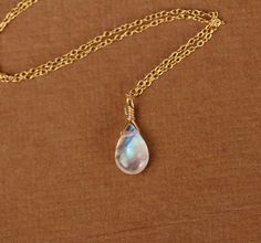 Rainbow moonstone necklace  gold moonstone necklace by BubuRuby Gold Moonstone Pendant Necklace, Gold Moonstone Jewelry With Delicate Chain, Spiritual Teardrop Moon Charm Jewelry, Moon Charm Teardrop Pendant Jewelry As Gift, Handmade Celestial Gold Jewelry, Delicate Moon Phase Pendant Jewelry, Yellow Gold Moon-shaped Jewelry With Delicate Chain, Ethereal Handmade Gold Necklaces, Delicate Yellow Gold Jewelry With Moon Charm