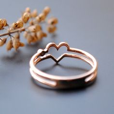 An simple but unique ring with double bands forming a heart in the center and a sparkling diamond on the side. It's you and your better half.. both your hearts :) Details: * Diamond Wt. : 0.01 Carat * Colour Clarity - H I, VS Si * Gold: 2.3 gms, 14kt Solid Rose Gold (Other options available) Rose Gold Love Heart Ring - Diamond Heart Ring - Valentine's Day Gift for Wife - Double Band Lover Ring - Symbol of Love - Gifts for Her -------------------- ** To keep your jewellery looking new, please avo Rose Gold Stackable Heart Ring For Wedding, Rose Gold Stackable Heart Ring For Valentine's Day, Rose Gold Heart Cut Stackable Rings For Promise, Stackable Rose Gold Heart Ring For Valentine's Day, Heart Cut Rose Gold Stackable Promise Rings, Rose Gold Open Heart Ring For Anniversary, Rose Gold Open Heart Wedding Ring, Minimalist Double Heart Anniversary Rings, Rose Gold Heart-shaped Stackable Rings As Gift