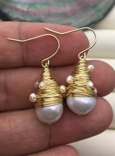 "This pearl is genuine freshwater pearl, 100% real pearl pearl luster: high+ metal: alloy plated 14k solid gold(it's high quality) pearl color: white,please look at picture Back to Other Jewelry Section 01: \"Flameball Pearl\" Section： https://www.etsy.com/shop/WenPearls?section_id=22535705 02: \"Edison Pearl\" Section: https://www.etsy.com/shop/WenPearls?section_id=18890242 03: \"Keshi Pearl\" Section: https://www.etsy.com/shop/WenPearls?section_id=22535725 04: \"Various Baroque Pearl\" Section White Gold Plated Pearl Earrings For Party, Akoya Pearl Dangle Earrings, Akoya Pearl Dangle Earrings In Pearl White, Pearl White Akoya Pearl Dangle Earrings, Akoya Pearl White Dangle Earrings, White Gold Plated Dangle Pearl Earrings, White Wire Wrapped Drop Jewelry, White Gold-plated Dangle Pearl Earrings, White Akoya Pearl Drop Earrings