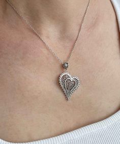 Introducing our Handcrafted Filigree Art Asymmetric Heart Figured Women's Silver Pendant Necklace! This stunning piece features a unique design with an asymmetric heart-shaped pendant, measuring 1.65 inches in height and 1.05 inches in width, suspended from a 20-inch silver chain. Expertly crafted with filigree art, this necklace is a beautiful addition to any jewelry collection. It comes with a silver polish cloth and a luxurious gift box, making it the perfect gift option for Mother's Day, ann Unique Heart Pendant Wedding Jewelry, Unique Heart Pendant Jewelry For Wedding, Silver Heart Necklace With Heart Detail, Handmade Double Heart Necklaces For Anniversary, Heart Shaped Large Pendant Jewelry For Anniversary, Heart-shaped Large Pendant Jewelry For Anniversary, Unique Silver Necklaces For Valentine's Day, Nickel-free Heart-shaped Jewelry For Wedding, Nickel-free Heart Necklace For Anniversary