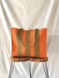 %100 handmade, Extra large beach bag, Stylish crochet bag, Raffia bag tote, Orange brown tote bag, Hobo bag, Woven bag, Handbag, Straw bag. A hand-knitted, large size straw beach bag in orange and brown colors. This shoulder bag is knitted from natural raffia rope. Ecofriendly bag . It is recyclable material. This summer bag with vertical, thick line pattern is suitable for carrying towels, creams, etc. when going to the beach. it allows you to easily carry all your belongings. You can also use Eco-friendly Orange Rectangular Straw Bag, Bohemian Jute Shoulder Bag For Shopping, Bohemian Brown Beach Bag For Shopping, Eco-friendly Square Jute Beach Bag, Jute Tote Beach Bag, Bohemian Tote Beach Bag For Shopping, Handwoven Brown Beach Bag, Handmade Brown Shoulder Bag For Beach Season, Summer Orange Straw Bag With Leather Handles