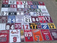 a blanket made out of football jerseys on the ground