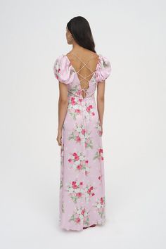 Take some time to stop and smell the roses in the gitanna floral maxi dress - a pink dress with a romantic rose bouquet print. it's finished with feminine touches including a fixed contrasting rosette at the neckline a cut-out front detail and intricate lace trims.    - plunging neck and waistline.  - lined cups with white lace trim.  - fixed rosette at the center front.  - cut-out front detail with intricate lace trims.  - functional lacing at the back which merges into shoulder straps.  - puff sleeves.  - rose bouquet print.  - a-line silhouette.  - invisible back zip closure.  - maxi length.  - lined.  - color: pink.  - fabric: light-weight chiffon.  - material: 44% viscose 56%ecovero viscose.  - model is 5'9.5" (176 cm) bust 32c (81 cm) waist 24" (61 cm) hips 34" (86 cm) and is wearing Spring Party Rose Print Maxi Dress, Chic Rose Print Maxi Dress, Chic Maxi Dress With Rose Print, Spring Rose Print Maxi Dress For Garden Party, Feminine Rose Print Maxi Dress For Summer, Feminine Summer Rose Print Maxi Dress, Feminine Rose Print Summer Maxi Dress, Feminine Summer Maxi Dress With Rose Print, Fitted Rose Print Maxi Dress For Brunch