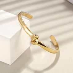 Our Sydney Bangle features a unique knot design that makes it a stand-out piece. This piece is incredibly versatile and can be worn every day. Details: Stainless Steel 18k Gold Plated Knot Bangle, Knot Design, Knot Bracelet, Love Knot, Unconditional Love, Jewelry Designs, Stainless Steel Bracelet, Sydney, Knot