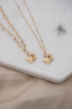 Details: - 14K Gold Filled Satellite chain - 18K Gold Filled Paperclip chain - Pendant size: Approx. 12.5mm X 11mm - Pendant material: 18K Gold Plated over copper Get our Butterfly combo set here: https://www.etsy.com/listing/1495802464/gold-butterfly-necklace-set-simple?click_key=ba3bd1b7a421d42203ecb90840799789ea620d92%3A1495802464&click_sum=6f495841&ref=shop_home_active_20&pro=1&frs=1&sts=1 Each item is individually placed on our MIKUKUMI leather card & cotton pouch.  What is Gold Filled? Gol Dainty Yellow Gold Butterfly Pendant Necklace, Elegant Gold Butterfly Charm Necklace, Delicate Yellow Gold Necklace With Butterfly Charm, Everyday Gold Butterfly-shaped Jewelry, Dainty Gold-plated Yellow Gold Butterfly Necklace, Dainty Gold Butterfly Jewelry, Dainty 14k Yellow Gold Butterfly Necklace, Delicate Yellow Gold Butterfly Necklace, Dainty Gold-plated Jewelry With Butterfly Charm