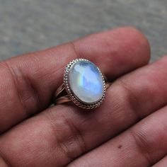 Gemstone - Natural Rainbow Moonstone Gemstone Size - 1x14 mm oval  Metal - Sterling Silver natural AAA rainbow moonstone set with a sterling silver handmade ring  Each Ring made with Precision and love, these rings are perfect for everyday use and a perfect accessory to wear at work.  Rings can be customized on request and gemstone can be switched to any other as per requirement.  Other beautiful designs uploaded with fabulous gemstones. kindly visit my store to view the complete collection.  Feel free to contact me for any queries regarding jewelry or for bulk order.  The ring will be gift wrapped in a premium handmade jewelry box Celestial Style Oval Cabochon Gemstone Ring, Celestial Oval Cabochon Gemstone Rings, Mystical Cabochon Rings As A Gift, Bohemian Moonstone Cabochon Jewelry, Mystical Round Cabochon Jewelry, Oval Silver Moonstone Gemstones, Oval Natural Stones Jewelry For Wedding, Handmade Oval Dainty Jewelry, Silver Celestial Oval Jewelry