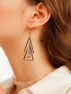 Sku CY-!24685 Material Alloy Feature Geometric Occasion Casual Type Earrings Accessories Color GOLD COLOR Size chart: Please consult the size chart we provide for this item's measurements to help you decide which size to buy. Please note: There may be 1-3cm differ due to manual measurement. Trendy Triangle Gold Jewelry, Trendy Gold Triangle Jewelry, Trendy Triangular Gold Jewelry, Trendy Triangle-shaped Gold Jewelry, Trendy Gold Triangle Earrings, Gold Dangle Hoop Earrings In Alloy, Triangle Gold Metal Earrings, Gold Triangle Metal Earrings, Gold Triangle Metal Jewelry