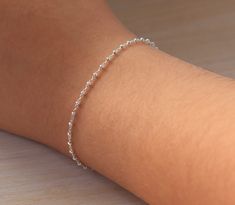 Sterling Silver Bracelet, Simple Thin Silver Bracelet on Delicate chain, Dainty Satellite Bracelet with Rondelle Beads I've made this dainty minimalist bracelet with tiny Sterling Silver rondelle beads fixed on delicate yet strong Sterling Silver chain to add a delicate touch to your look. Ideal present for the ones you love if you beat the temptation to keep it for yourself. ⭐️ DETAILS Sterling Silver chain accented with rondelle beads 2 mm Sterling Silver spring ring closure Comes in a Gift Bo Simple White Gold Bracelet, Cute Silver Bracelets Simple, Simple Silver Accessories, Silver Women Bracelet, Silver Dainty Bracelet, Acotar Accessories, Cute Bracelets Silver, Silver Bracelet For Women Simple, Dainty Sterling Silver Bracelets