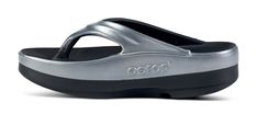 The OOmega OOlala is a versatile, modern take on the traditional OOlala active recovery sandal. Still featuring the same proprietary OOfoam™ technology and patented footbed design - the addition of the MEGA midsole gives you an extra 15mm of impact-absorbing OOfoam™ technology. The OOmega is a step forward in fashion and another step into active recovery. OOmega, a women’s platform sandal for trend-setting recovery, day or night. Unique in footwear and only from OOFOS. Stack: Elevated color comb Recovery Sandals, Active Recovery, Black Basalt, Elevated Style, In Fashion, Platform Sandals, Color Combos, Comb, Technology