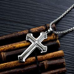 This black silver stainless steel cross pendant necklace for men is crafted to be allergy-free and resistant to fading. It features gold plating, a hard texture, and is tarnish-resistant and nickel-free. The pendant is engraved with the English Lord's Prayer, making it a meaningful and holy gift for those with religious beliefs. The pendant measures 2.55 inches (6.5 cm) in length and 1.6 inches (4.1 cm) in width, and it comes with a sturdy 23.6-inch (60 cm) stainless steel chain. Its fashion-forward, contracted design allows it to be worn as a standout piece, reflecting individual character and style. Originating from biblical tradition, the cross symbolizes humility and sacrifice, and is a powerful reminder of faith and transformation. Available in four colors, this necklace is a timeless Engraved Stainless Steel Cross Necklace, Engraved Stainless Steel Cross Necklaces, Father's Day Stainless Steel Cross Pendant Necklace, Father's Day Stainless Steel Cross Necklace, Engraved Stainless Steel Cross Pendant Necklace, Silver Cross Pendant Necklace For Father's Day, Father's Day Silver Cross Pendant Necklace, Engraved Stainless Steel Cross Jewelry, Stainless Steel Cross Necklace Tarnish Resistant