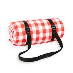 a red and white checkered blanket with black straps on the strap is laying down