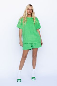 The LA Woman Set is made from a soft terry cloth fabric. Oversized with Los Angles embroidery at chest. Crew neck and hort sleeve top. Shorts feature an elastic waist side pockets. Also comes in white! Color: Kelly Green Terry Cloth Top: Short Sleeve, Oversized Fit With Los Angeles Embroidered At Chest Short: Elastic Waist, Side Pockets 80% Cotton/20% Polyester Model 5'7", 32A Bust and Wearing Size Medium Size Up For More Oversized Fit Also Comes In White Short Sleeve Tops With Elastic Waistband For Loungewear, Green Relaxed T-shirt For Loungewear, Green Short Sleeve Tops For Leisure, Green Crew Neck T-shirt For Leisure, Casual Tops With Elastic Waistband, Green Crew Neck T-shirt, Sporty Cotton Tops With Elastic Waistband, Short Sleeve Cotton Tops With Elastic Waistband, Cotton Short Sleeve Tops With Elastic Waistband