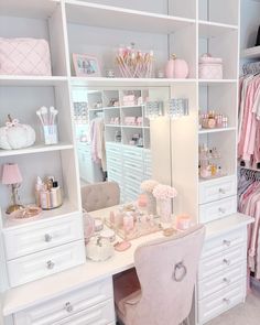 a white desk topped with a pink chair next to a closet filled with baby items