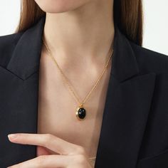 ▼Description The Agate Pendant 18kt gold necklace suspends a striking oval white onyx-a precious stone thought to stimulate imagination and creativity. It has a fine-link chain. ◄Details Composition: 18 kt gold brass/agate18 kt gold chainHeart clasp fastening ◄Size & Fit Chain length: 42cmPendant size: 2*1.5cmExtra length chain: 5cm Adjustable length ◄Shipping Information Free standard shipping on all orders. An average shipping interval for standard delivery is 5-14 working days. Necklace C, Agate Pendant Necklace, White Onyx, Black Agate, Gold Brass, Agate Pendant, Gold Black, Chain Lengths, Gold Chains