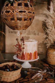 a cake sitting on top of a table next to other food and utensils