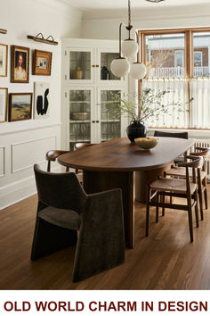 an old world charm in design with pictures on the wall and chairs around the table