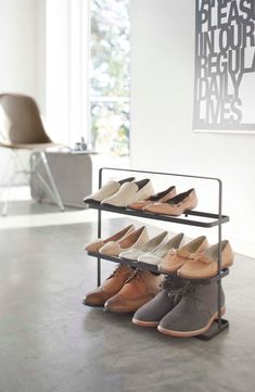 there are many pairs of shoes on the rack