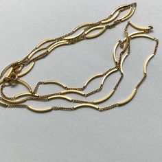 This Is Truly A Fabulous Estate Fine! This Vintage Solid Gold Necklace Measures 34 Inches Long And Weighs Almost 10 Grams! It Has A Combination Of Solid Gold Curved Bars, Which Are Separated By Small Sections Of Curb Link Style Chain. The Pattern Repeats For The Entire Necklace. There Does Appear To Be One Section Of The Chain That Was Previously Soldered, Which Has A Black Mark.**See Photo. It Is About 3 1/2 Inches Down From The Clasp So There’s A Good Chance That It Would Be Hidden By Your Hair. This Chain Is In Otherwise Good Preowned Condition. I Have Gently Cloth Polished It And Cleaned It In The Ultrasound. It Has A Spring Ring Class That Closes Securely With A Larger Jump Ring Conne Elegant 14k Gold Bar Necklace, Elegant 14k Gold Bar Necklace With Adjustable Chain, Elegant 14k Gold Bar Necklace For Formal Occasions, 14k Yellow Gold Double Strand Chain Necklace, Elegant Gold Bar Necklace With Cable Chain, Modern 14k Yellow Gold Bar Necklace, Classic Yellow Gold Bar Necklace For Formal Occasions, Modern Yellow Gold Bar Necklace For Formal Occasions, Elegant 14k Gold Bar Necklace With Cable Chain