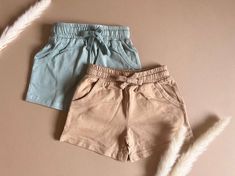 Made with 100% organic cotton and single knitted jersey, these shorts are not only soft and gentle on your child's delicate skin, but also eco-friendly and sustainable. With their relaxed cut design, these shorts provide the perfect blend of style and comfort, allowing your child to move and play freely. Featuring pockets for added convenience, these shorts are available in neutral pastel colors that are both cute and versatile, making them easy to pair with other outfits. Organic Cotton Summer Shorts For Everyday Wear, Organic Cotton Shorts For Everyday Summer Wear, Cotton Shorts For Playwear, Organic Cotton Shorts For Loungewear, Organic Cotton Shorts For Summer Loungewear, Organic Cotton Loungewear Shorts For Summer, Organic Cotton Summer Bottoms Short Length, Organic Cotton Shorts With Elastic Waistband, Organic Cotton Bottoms With Elastic Waistband