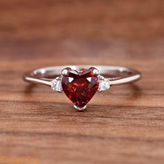 Heart Red Cubic Zirconia Sterling Silver Ring, Simulated January Birthstone Garnet Color CZ Sterling Silver Girls Womens Ring ▷Gift Box Included ▷7mm Height ▷Size 3 - 12 Available ▷925 Sterling Silver (not plated or filled) ▷925 Stamp Authenticity ▷High-Quality Cubic Zirconia Used https://www.etsy.com/shop/TrendyRing Red Cubic Zirconia Birthstone Jewelry, Red Heart-shaped Cubic Zirconia Jewelry, Red Diamond Heart Ring For Anniversary, Red Heart Diamond Ring For Anniversary, Red Heart Shaped Diamond Anniversary Ring, Heart-shaped Diamond Ring For Anniversary, Red Heart-shaped Promise Jewelry, Valentine's Day Red Heart Sterling Silver Ring, Red Cubic Zirconia Promise Ring