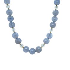 This pretty necklace pairs lovely, translucent 10mm blue chalcedony beads with adularescent blue moonstone for a look of unmistakably refined beauty. Perfect for wearing to the office, lunch with friends, or an elegant evening out! Hand strung on blue silk thread with 18k yellow gold faceted bead accents and finished with a 14k yellow gold hook-and-eye clasp. This necklace measures twenty (20) inches in length and will make a beautiful and versatile addition to your jewelry wardrobe!This necklac Elegant Moonstone Gemstone Beaded Necklace, Elegant Agate Crystal Necklace With Faceted Beads, Blue Chalcedony Bead Necklaces, Blue Chalcedony Round Beads Necklace, Elegant Moonstone Necklaces With Gemstone Beads, Elegant Moonstone Necklace With Gemstone Beads, Elegant Moonstone Beaded Necklaces, Elegant Light Blue Necklaces With Natural Stones, Elegant Light Blue Jewelry With 8mm Beads