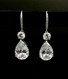 "𝐃𝐞𝐬𝐜𝐫𝐢𝐩𝐭𝐢𝐨𝐧 : *Pear With Round Moissanite Diamond Dangle earring, Leverback Earring For Women, Dangle & Drop Earring, 925 Sterling Silver Teardrop Earring. Let's Design Your Jewelry with Moissanite. Moissanite is a gemstone that looks a lot like a diamond. It possesses fire, brilliance, and lustre more than that of a diamond. It is not a fake diamond. ❖ 𝐃𝐢𝐚𝐦𝐨𝐧𝐝 𝐃𝐞𝐭𝐚𝐢𝐥𝐬 *Color : White *Clarity : VVS *Cut : Excellent *Shape : Pear *Stone Size : 1.50, 5.80, 14*10 MM *Total Luxury Brilliant Cut Teardrop Earrings, Luxury Silver Teardrop Earrings With Brilliant Cut, Luxury White Gold Diamond Cut Teardrop Earrings, Luxury Classic Brilliant Cut Teardrop Earrings, Luxury Classic Teardrop Earrings With Brilliant Cut, Luxury Teardrop Brilliant Cut Earrings, Luxury Brilliant Cut Teardrop Earrings For Formal Occasions, Luxury Classic Silver Teardrop Earrings, Luxury Silver Dangle Teardrop Earrings