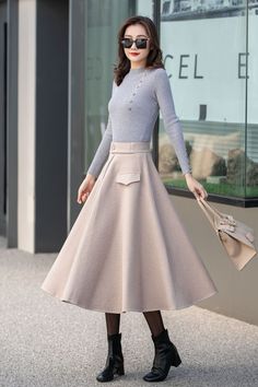 "This beige wool skirt is elegant and comfortable, which is the best choice for winter. DETAIL * More choices https://etsy.me/3Pwo3Fj * 30% wool, 30% fiber, 40% polyester * polyester lining * Two pockets * Back zipper closure * Below knee length effect * Perfect for autumn winter * Dry cleaning * Lean More about the items From the FAQs on the page bottom * The model is 170 cm (5′ 7″) tall with a 80 cm (31.5\") bust, 66 cm (26\") waist. She is wearing the plaid wool skirt in size XS. CUSTOM MADE Chic A-line Winter Skirt, Beige A-line Pleated Skirt For Fall, Elegant A-line Bottoms For Winter, Elegant Winter Maxi Skirt, Chic Cream Fall Skirt, Chic Wool Skirt For Winter, Chic Winter Wool Skirt, Elegant Solid Pleated Skirt For Winter, Chic Full Maxi Skirt For Winter