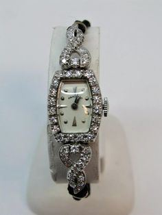 One stamped & tested 14KT white gold lady's hand assembled diamond watch with a bright polish finish. Condition is good. The watch is a Hamilton and a mechanical movement. Identified with the markings of "16174". Circa 1950s Containing: Forty-six bead set single cut diamonds, measuring 1.50 - 1.50 x 0.90mm (depth est.) approximate total weight of 46 stones = 0.57 ct. Clarity: VS Color:  G-H Cut:     Good Total weight of diamonds: 0.57 ct. Total weight of watch:       10.00gm Comes W/ Appraisal TOTAL RETAIL VALUE: $1,970.00 Get it here for only $985.00 Or MAKE AN OFFER  Free Fedex 2 Day Shipping Within The U.S ------------------------------------------------------------------------------------------- Your satisfaction is important to us. Your feedback is very important for us to continue to Lady Watch, Marcasite Jewelry, Bead Set, Mechanical Movement, San Antonio Tx, Diamond Watch, Wrist Watches, Vintage 1950s, Vintage Watches