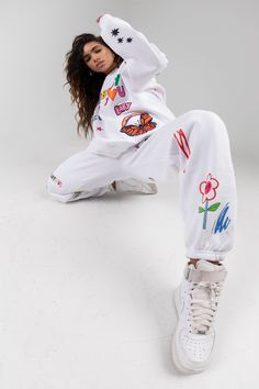 This is a Pre-Order, item will ship by 11/25 Mayfair x ISCREAMCOLOUR collaboration White doodle sweatpants 100% Cotton Image 1: Model is 5'8" and wearing size S/M Turn inside out and machine wash cold with like colors Playful Cotton Joggers For Loungewear, Playful Cotton Sweatpants For Loungewear, Playful Relaxed Fit Sweatpants For Loungewear, Playful Sweatpants With Elastic Waistband For Loungewear, White Sporty Sweatpants With Graphic Print, Sporty White Sweatpants With Graphic Print, White Graphic Print Sweats For Loungewear, White Playful Relaxed Fit Bottoms, Playful Cotton Bottoms For Streetwear