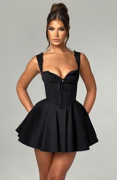 The super flirty, romantic Antonella mini dress will take you from bottomless brunch to garden parties and more. Made from a lightweight cotton blend, this mini has a super cinched waist contrasted with a full skirt, pintuck detailing to the front and lace up back. The fan shaped straps are adjustable for your perfect fit. Wear yours with lemon heels and bag. 



Colour: Black.

Premium nylon cotton blend fabric.

Fully lined.

Button detailing to bust.

Fan shape adjustable straps.

Tie on unde Holiday Dresses Women, Bottomless Brunch, Elegant Mini Dress, Black Tie Dress, Suspender Skirt, Backless Mini Dress, Mini Robes, Mini Dresses For Women, Chic Outfit