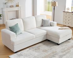 a living room with a white sectional couch