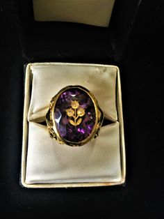 Beautiful 14k gold, amethyst and diamond ring from the Victorian era. The sides of the ring are very detailed and decorative with shamrocks. In the Victorian times it was common to use colored stones for a wedding ring. The design of this ring symbolizes consumed with love and great luck in love. Victorian Style Purple Amethyst Ring For Anniversary, Heirloom Amethyst Ring, Victorian Purple Wedding Rings, Purple Elegant Signet Ring For Formal Occasions, Formal Vintage Amethyst Ring, Victorian Style Formal Purple Ring, Antique Gemstone Signet Ring For Wedding, Yellow Gold Amethyst Ring Stamped 14k, Victorian Wedding Signet Ring With Gemstone