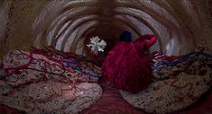 an image of a doll in the middle of a tunnel with red and blue material