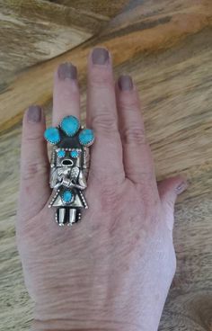 ** RUSH SHIPPING IS AVAILABLE! GET YOUR ITEMS IN TIME FOR CHRISTMAS! ** Large Kachina ring in sterling silver and turquoise stones is truly unique! This statement ring is carefully handmade with intricate sterling silver detail work and including concho pieces on the sides and is set off with a lovely turquoise stones. If you love Navajo jewelry, you will love this sterling silver ring.  These are naturally occuring stones, so stones may vary from pictures. If you would like to see the stones, p Rings Chunky, Handmade Jewelry Ring, Native American Rings, Rings Handmade, Ring Turquoise, Navajo Jewelry, Chunky Rings, Turquoise Stones, Turquoise Rings