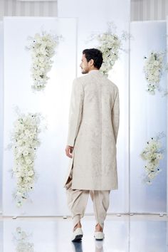 This sherwani set features all over matt sequin on a sand raw silk base. It is paired with off-white silk kurta and soften raw silk afghani salwar. Complimenting stole and footwear is also available.From Seema Gujral's Tuscan Summer collection. DELIVERY TIMEPlease allow 8-12 weeks for your outfit to arrive.FABRIC DETAILSRaw SilkProfessional cleaning only. Luxury Off-white Sherwani With Naqshi, Luxury White Sherwani With Chikankari Embroidery, Afghani Salwar, Peach Sherwani, Tuscan Summer, Blue Sherwani, Light Blue Blazer, Aari Embroidery, Silk Kurta