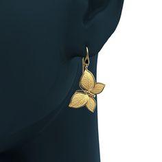 Experience Italian craftsmanship at its finest with our exquisite gold dangle drop earrings. The centerpiece of these earrings is a delicate butterfly with elegantly crafted leaves as its wings, creating a captivating and nature-inspired design. Available in both 14k and 18k gold, these earrings bring a touch of luxury and nature's beauty to your style. Elevate your look with the perfect blend of Italian artistry and organic elegance, shop now to adorn yourself with this unique masterpiece. 14k Elegant Leaf Shaped Earrings As Gift, Elegant Leaf-shaped Earrings For Gift, Elegant Leaf-shaped Earrings, Elegant 14k Gold Butterfly Jewelry, Elegant Gold Earrings With Butterfly Charm, Elegant Butterfly Charm Earrings, Elegant Pierced Butterfly Jewelry, Elegant Butterfly Earrings For Formal Occasions, Elegant Leaf-shaped Jewelry For Formal Occasions