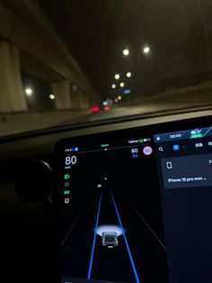 an image of a car driving on the road at night time with its head up display