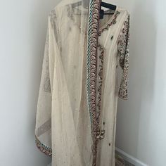 Elegant And Modest Palazzo And Kameez Suit With Dupatta. Shirt Is In Mysoori Fabric With Hand Embroidered Sleeves And Hems. Palazzo Pants Are Jamawar Fabric In Cream And Gold. This Suit Was Only Worn Once And Is Almost Brand New. Purchased From Asma&Shumaila Boutique In San Francisco Ca In November 2023. Navratri Long Sleeve Salwar Kameez With Sheer Dupatta, Festival Kurta With Sheer Dupatta And Long Sleeves, Festive Kurta With Sheer Dupatta And Long Sleeves, Festival Long Sleeve Kurta With Sheer Dupatta, Festival Long Sleeve Sharara With Sheer Dupatta, Festive Traditional Wear With Sheer Dupatta And Long Sleeves, Long Sleeve Sets With Sheer Dupatta For Navratri, Festive Full-length Embroidered Dupatta, Eid Sharara With Sheer Dupatta