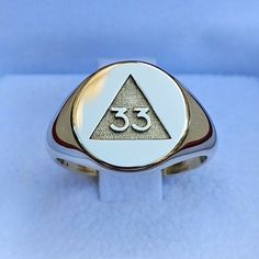 We are pleased to introduce our new ring for all Grand Inspectors Generals of the 33°, Chevalier style for the small finger. One of the most iconic symbols of Freemasonry that few people have been able to decipher, even holders of the degree. Available in large quantities other metals and other stones upon request. Box dimensions of 45 Χ 50 Χ 40 mm having a total weight of 45 grams. Delivery and Postage: Postage of non-gold items is serviced with standard delivery options. Standard delivery is b Symbolic White Gold Engraved Open Ring, Symbolic White Gold Rings For Anniversary, Symbolic White Gold Engraved Promise Ring, Symbolic White Gold Signet Ring For Formal Occasions, Symbolic Engraved Yellow Gold Ring, Hallmarked, Symbolic Engraved Ring For Anniversary, Classic White Gold Ring With Si Clarity, Timeless Silver Engraved Ring Stamped 14k, Symbolic Signet Ring With Polished Finish