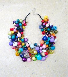 Materials: glass, acrylic, wood (8-14 mm). 3 cords. Circumference: 48 cm plus 5 cm adjustment. Anti-allergic clasp (nickel, cadmium and lead free). Adjustable Multicolor Bib Necklaces With Colorful Beads, Multicolor Multi-strand Costume Jewelry Beads, Unique Multicolor Bib Necklace With Colorful Beads, Unique Multicolor Bib Necklaces With Colorful Beads, Colorful Multi-strand Beads For Jewelry Making, Unique Rainbow Beaded Necklaces, Unique Multicolor Round Beads Bib Necklaces, Unique Multicolor Round Beads Bib Necklace, Colorful Multi-strand Large Beads Jewelry