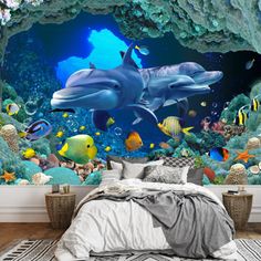 two dolphins swimming in an underwater cave with corals and fish wall mural decal