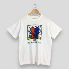 Vintage 1993 Keith Haring Hug Pop Art T shirt Medium Keith Haring Act Against Aids Artwork Streetwear 80s Graffiti White Tees Size M by slayvin on Etsy 80s Graffiti, Keith Haring, Art T Shirt, Used Clothing, Dhl Express, Vintage Clothing, Favorite Outfit, Pop Art, Graffiti