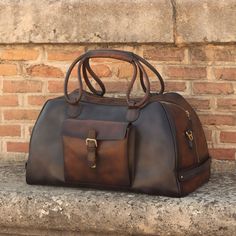 Ideal for overnight or weekend trips, the travel duffle is the best option to carry all your essentials in style. There’s virtually no place where a leather duffel bag would feel awkward or out of place. It measures 21.6 x 11.8 x 11.0 inches / 55 x 30 x 28 cm and features an outside pocket perfect for the little items that could otherwise get lost at the bottom of your bag, full lined interior and a removable shoulder strap. THE DETAILS: Materials: grey painted calf + med brown painted calf + da Designed Shoes, Leather Duffel Bag, Mens Luggage, Leather Duffel, Custom Design Shoes, Travel Duffle Bag, Mens Travel, Hot Style, Leather Travel Bag