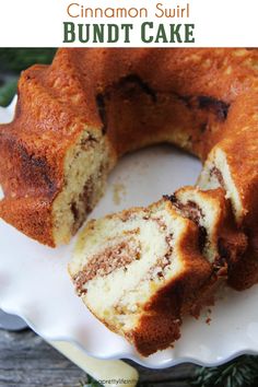 a cinnamon swirl bundt cake on a plate with the inside cut out and ready to be eaten