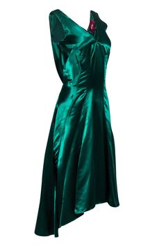 Look sleek and sexy this holiday season in a stunning Sies Marjan dress! An elegant option for a formal event or holiday cocktail party, this shimmering satin beauty will turn-heads with its gorgeous emerald green hue and elongated darts. Show off this midi's flattering high-low design with a pair of strappy metallic heels and plenty of gold jewelry. Size 4 100% Viscose Concealed back zipper V-neckline High-low hem Small snag on back near bottom Blemish at v-neckline Bust 32" Waist 30" Shoulder Dark Green Satin Dress Nordstrom, Green Satin Knee-length Evening Dress, Green Knee-length Satin Mini Dress, Chic Green Bias-cut Satin Dress, Green Sleeveless Bias-cut Satin Dress, Emerald Green Cocktail Dress, Green Cocktail Dress, Holiday Cocktail Party, Metallic Heels