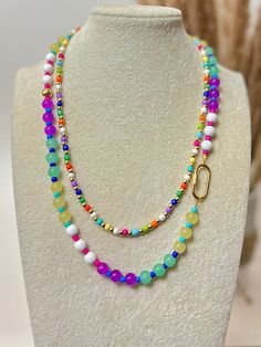 18" colorful necklace with extender Each necklace sold separately Disclaimer: colors could vary slightly from photos Colorful Adjustable Multi-strand Jewelry, Adjustable Rainbow Necklace With Colorful Beads, Adjustable Multicolor Beaded Charm Necklaces, Colorful Necklace With Adjustable Chain As Gift, Trendy Multicolor Pearl Necklace Gift, Trendy Multicolor Pearl Necklace For Gift, Trendy Multicolor Pearl Necklace, Rainbow Colorful Beads Necklaces For Jewelry Making, Adjustable Rainbow Round Bead Necklaces