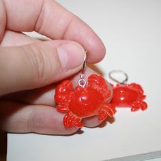 "Red Crab Earrings They measure 1.25\" long Hooks are sterling plated, extra secure and work with gauges" Red Resin Novelty Earrings, Novelty Red Resin Jewelry, Red Resin Novelty Jewelry, Red Novelty Drop Earrings, Novelty Red Pierced Earrings, Crab Earrings, Red Crab, Ocean Earrings, Mermaid Earrings